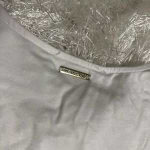 NWT Michael Kors tank ~ longer and flowing. Size S. Charm on the back at neck.